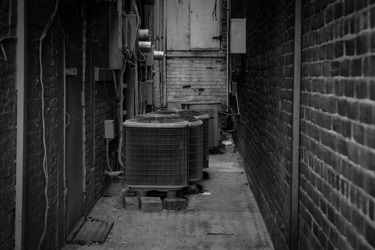 Summit Comfort technician servicing a home HVAC system in Lebanon, Missouri