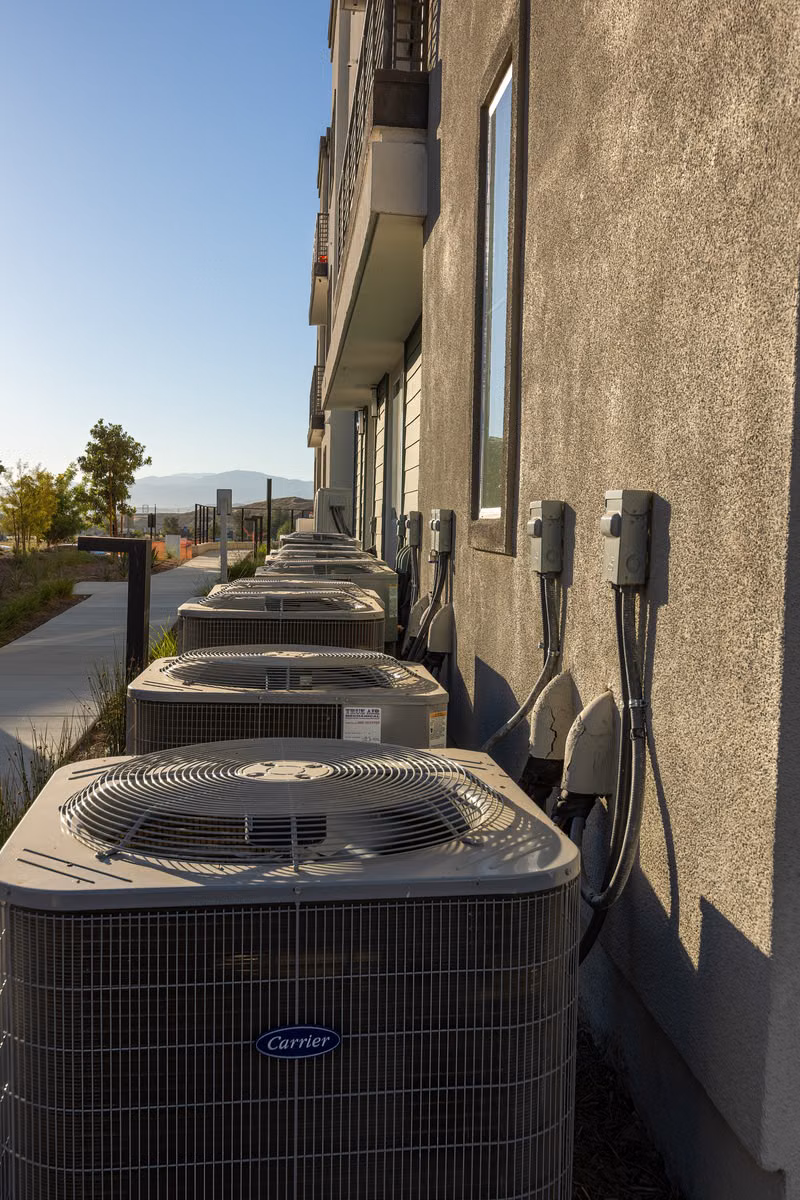 New outdoor HVAC condenser installed beside a residential home in Lebanon Missouri
